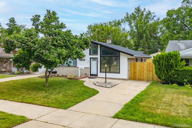 25288 Hopkins St, Dearborn Heights, MI 48125 - mid-century modern home featuring a chimney