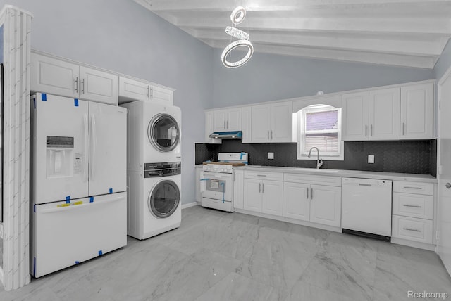 25288 Hopkins St, Dearborn Heights, MI 48125 - laundry room featuring stacked washer / dryer, light marble finish flooring, and a towering ceiling
