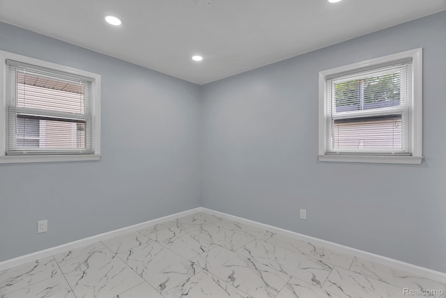 25288 Hopkins St, Dearborn Heights, MI 48125 - empty room featuring marble look tiles and recessed lighting
