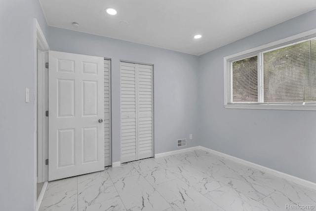 25288 Hopkins St, Dearborn Heights, MI 48125 - unfurnished bedroom with light marble finish flooring, recessed lighting, and a closet