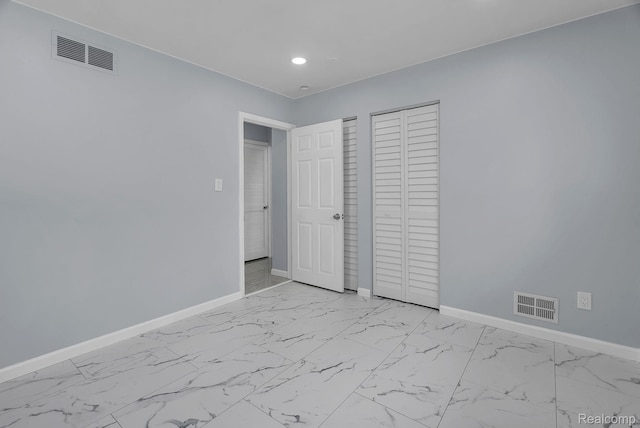 25288 Hopkins St, Dearborn Heights, MI 48125 - unfurnished bedroom featuring recessed lighting, light marble finish flooring, and a closet