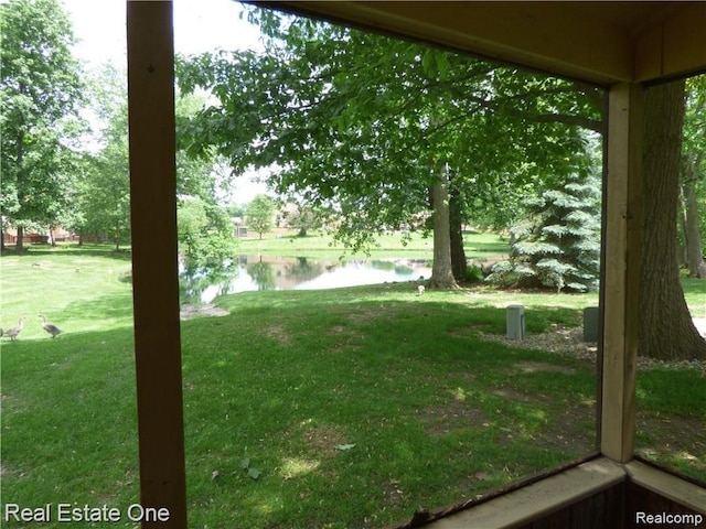25748 Lexington Dr Unit 5, South Lyon, MI 48178 - view of grassy yard featuring a water view