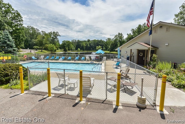 25748 Lexington Dr Unit 5, South Lyon, MI 48178 - community pool featuring view of scattered trees