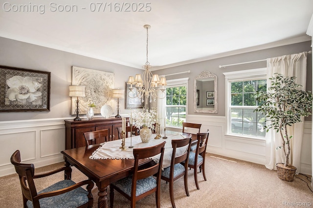 4190 Derry Ct, Oakland, MI 48306 - dining room with a decorative wall, light colored carpet, crown molding, a chandelier, and wainscoting