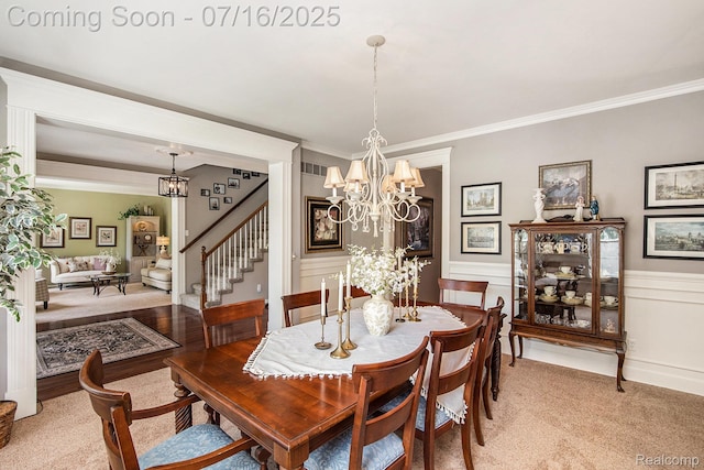4190 Derry Ct, Oakland, MI 48306 - dining area with a chandelier, stairway, ornamental molding, wainscoting, and light carpet