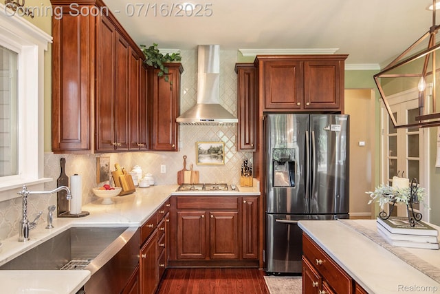 4190 Derry Ct, Oakland, MI 48306 - kitchen featuring stainless steel refrigerator with ice dispenser, wall chimney exhaust hood, backsplash, dark wood-style flooring, and gas stovetop