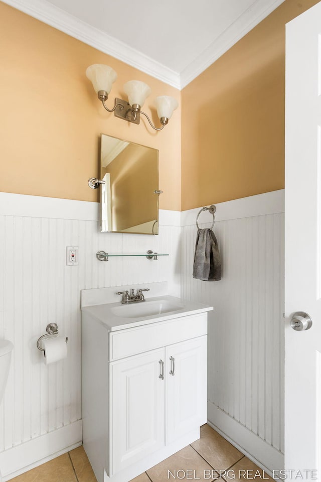 1307 Waverly Ave, Grand Haven, MI 49417 - bathroom with tile patterned floors, vanity, wainscoting, and ornamental molding