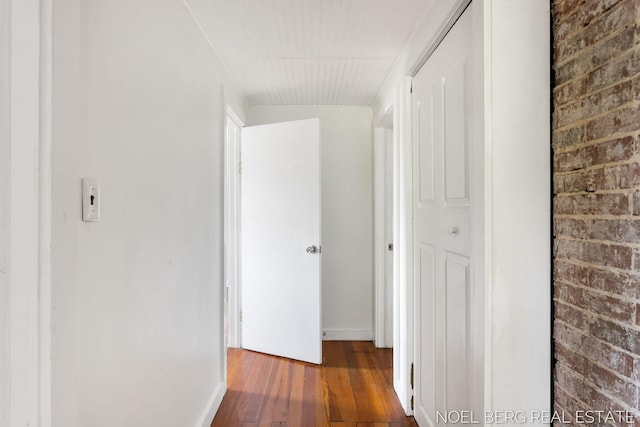 1307 Waverly Ave, Grand Haven, MI 49417 - corridor with wood-type flooring and brick wall
