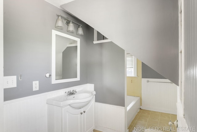 1307 Waverly Ave, Grand Haven, MI 49417 - full bathroom featuring wainscoting, vanity, a tub, and wood walls