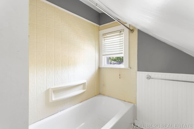 1307 Waverly Ave, Grand Haven, MI 49417 - bathroom featuring a bath and vaulted ceiling