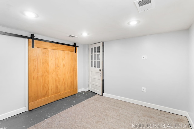 1307 Waverly Ave, Grand Haven, MI 49417 - spare room featuring recessed lighting, a barn door, and concrete flooring