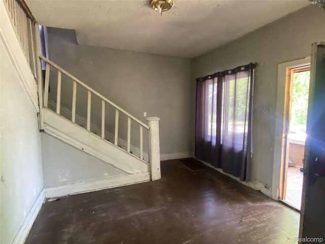 197 Richton St, Highland Park, MI 48203 - entryway featuring stairs and unfinished concrete flooring