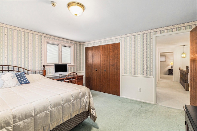 4213 Wentworth Dr, Troy, MI 48098 - carpeted bedroom with wallpapered walls, a closet, and wainscoting