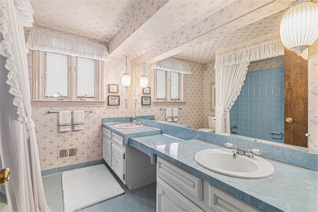 4213 Wentworth Dr, Troy, MI 48098 - full bathroom with double vanity, wallpapered walls, and tile patterned floors