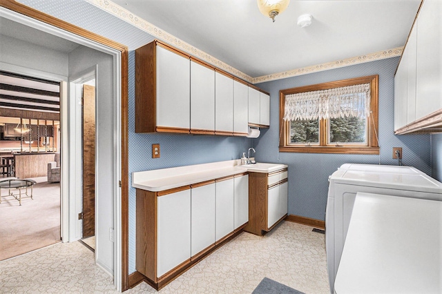 4213 Wentworth Dr, Troy, MI 48098 - laundry room featuring cabinet space, washing machine and clothes dryer, and wallpapered walls