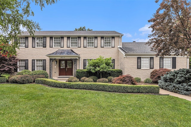 4213 Wentworth Dr, Troy, MI 48098 - view of front facade featuring a front yard, brick siding, and a shingled roof