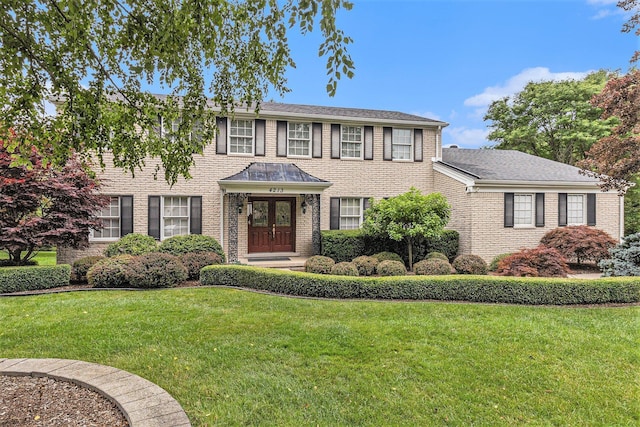 4213 Wentworth Dr, Troy, MI 48098 - colonial inspired home featuring a front lawn and brick siding