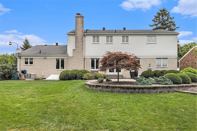 4213 Wentworth Dr, Troy, MI 48098 - back of property featuring a chimney, a yard, brick siding, and a patio