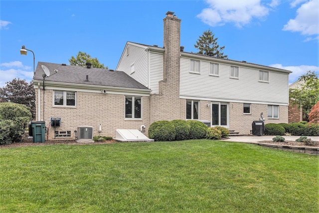 4213 Wentworth Dr, Troy, MI 48098 - back of property featuring a chimney and a lawn