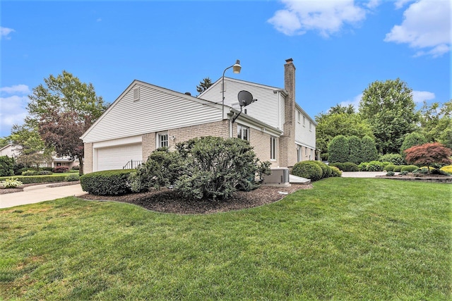 4213 Wentworth Dr, Troy, MI 48098 - view of side of property featuring brick siding, a yard, a chimney, and an attached garage