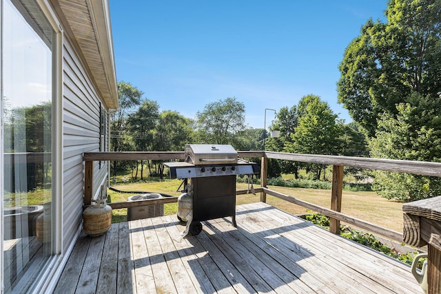 6671 E 136th St, Sand Lake, MI 49343 - deck featuring a grill and a lawn
