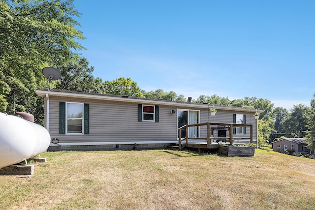 6671 E 136th St, Sand Lake, MI 49343 - back of property with a lawn, a deck, and crawl space