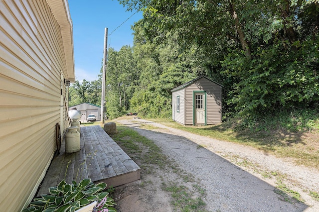 6671 E 136th St, Sand Lake, MI 49343 - view of yard featuring a storage unit