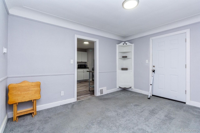 3602 Chatsworth St, Detroit, MI 48224 - foyer entrance featuring carpet and baseboards