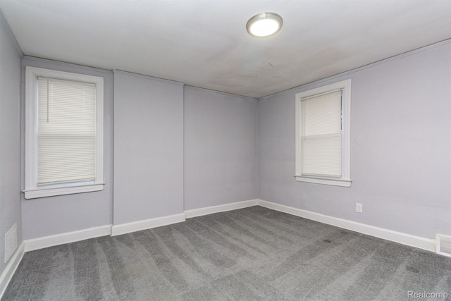 3602 Chatsworth St, Detroit, MI 48224 - carpeted spare room featuring baseboards