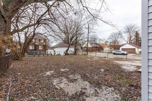 3602 Chatsworth St, Detroit, MI 48224 - view of yard featuring a residential view and a garage