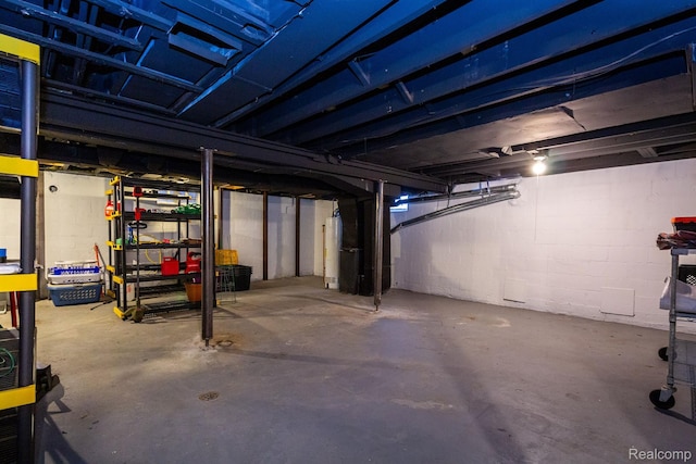 3602 Chatsworth St, Detroit, MI 48224 - unfinished below grade area featuring water heater and concrete block wall