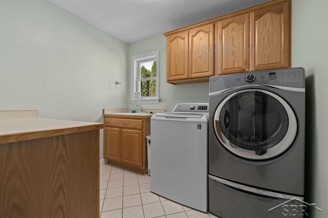 936 Appaloosa Pass, Auburn, MI 48611 - washroom with cabinet space, washer and dryer, and light tile patterned floors