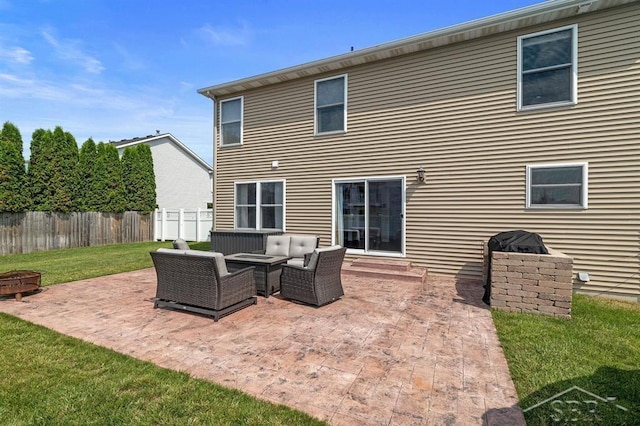 936 Appaloosa Pass, Auburn, MI 48611 - rear view of property with a patio area and an outdoor hangout area