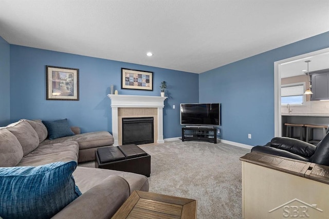 936 Appaloosa Pass, Auburn, MI 48611 - carpeted living area with a tiled fireplace and recessed lighting