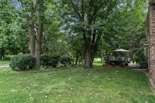 2840 Tuebingen Pkwy, Ann Arbor, MI 48105 - view of grassy yard with a wooden deck