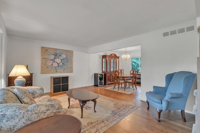 2840 Tuebingen Pkwy, Ann Arbor, MI 48105 - living area with a chandelier and light wood-style floors