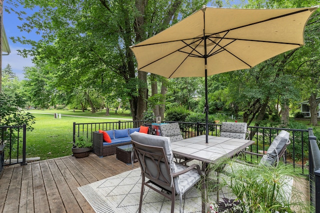 2840 Tuebingen Pkwy, Ann Arbor, MI 48105 - wooden terrace with outdoor dining space, a lawn, an outdoor living space, and view of scattered trees