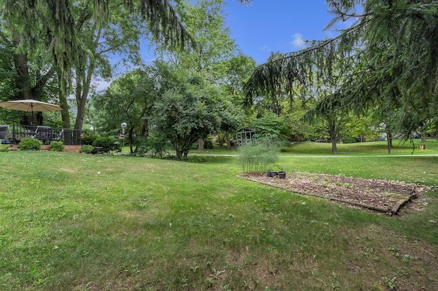 2840 Tuebingen Pkwy, Ann Arbor, MI 48105 - view of grassy yard featuring a deck