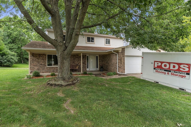 2840 Tuebingen Pkwy, Ann Arbor, MI 48105 - traditional-style home with brick siding, a garage, a front yard, and a porch