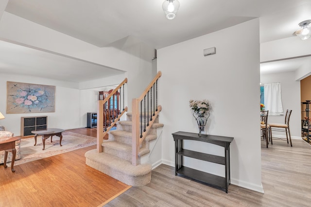 2840 Tuebingen Pkwy, Ann Arbor, MI 48105 - stairs featuring wood finished floors and baseboards