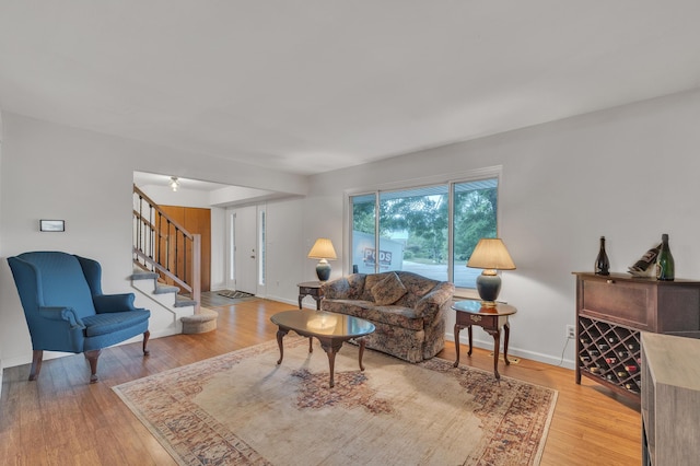 2840 Tuebingen Pkwy, Ann Arbor, MI 48105 - living room featuring stairs and light wood-style floors