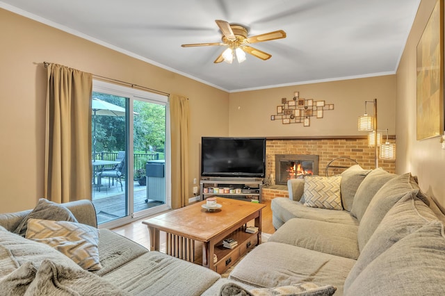 2840 Tuebingen Pkwy, Ann Arbor, MI 48105 - living room with ceiling fan, a brick fireplace, crown molding, and wood finished floors