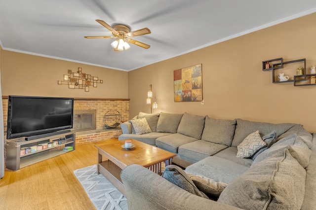 2840 Tuebingen Pkwy, Ann Arbor, MI 48105 - living area featuring ceiling fan, wood finished floors, crown molding, and a fireplace