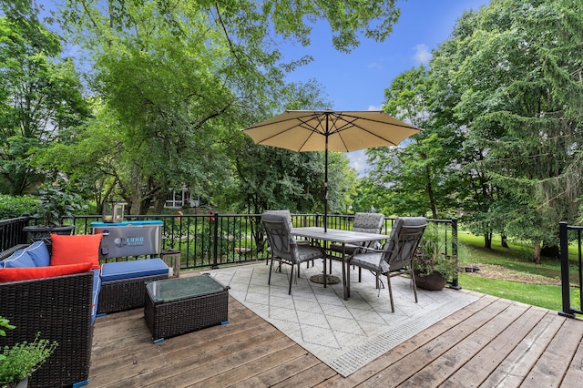 2840 Tuebingen Pkwy, Ann Arbor, MI 48105 - wooden terrace with outdoor lounge area, outdoor dining space, and view of wooded area