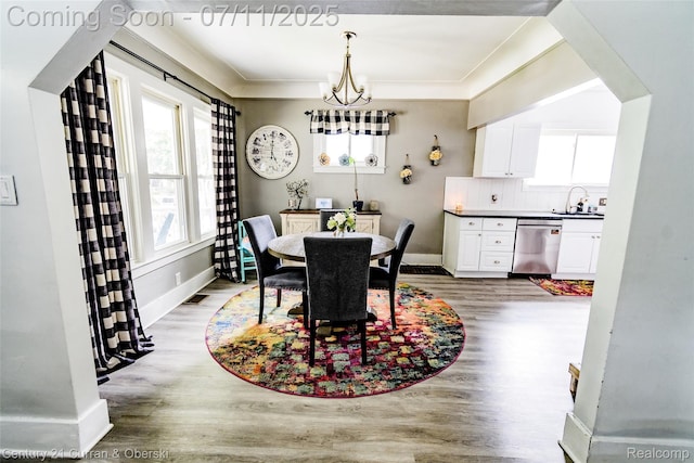 4168 Polk St, Dearborn Heights, MI 48125 - dining space with wood finished floors and a chandelier
