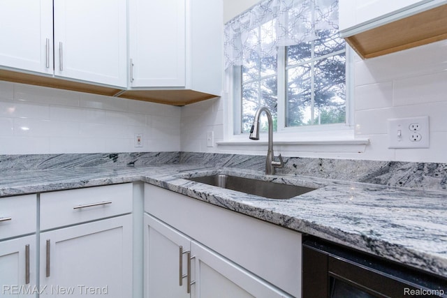 30604 Ann Arbor Trl, Westland, MI 48185 - kitchen with white cabinets, decorative backsplash, and light stone counters