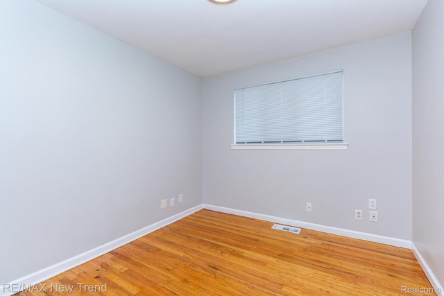 30604 Ann Arbor Trl, Westland, MI 48185 - unfurnished room with baseboards and light wood-type flooring