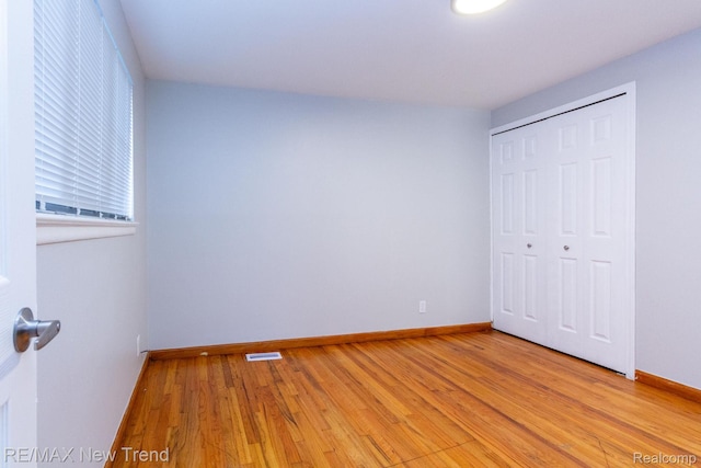 30604 Ann Arbor Trl, Westland, MI 48185 - unfurnished bedroom featuring light wood-style floors and a closet