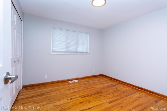 30604 Ann Arbor Trl, Westland, MI 48185 - unfurnished bedroom with a closet and light wood-style flooring
