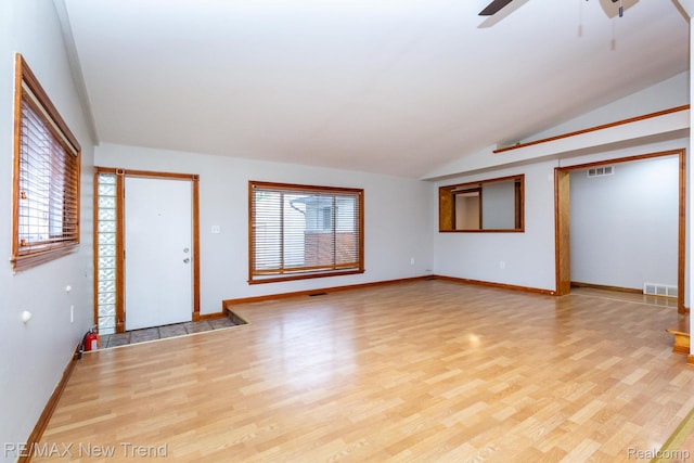 30604 Ann Arbor Trl, Westland, MI 48185 - unfurnished living room with lofted ceiling, wood finished floors, and ceiling fan